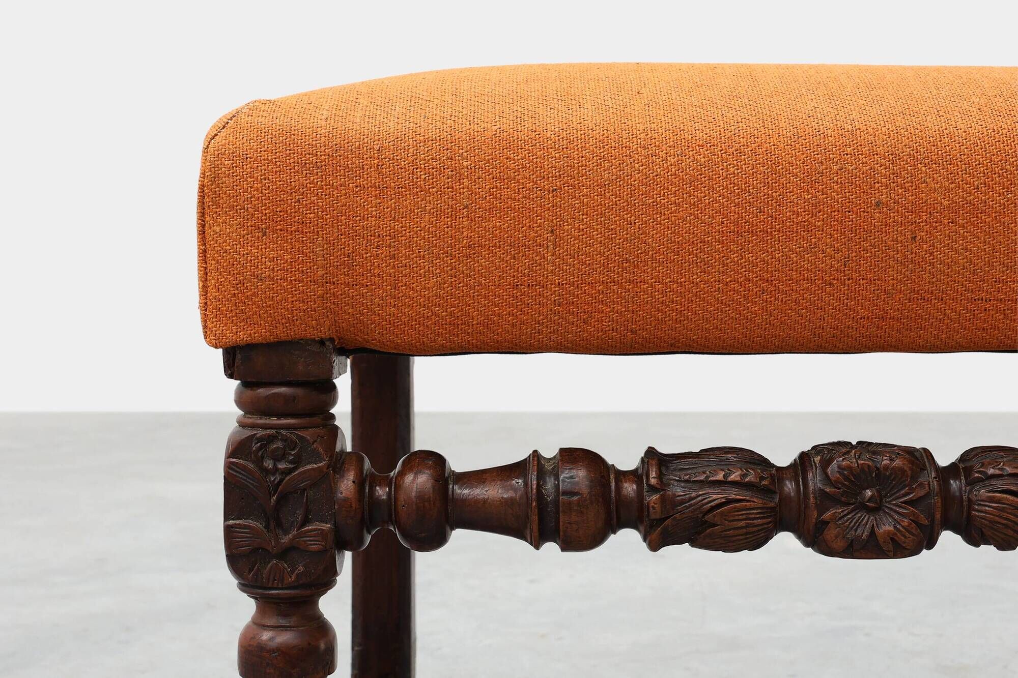 Louis XIII walnut stool with carved turned stretchers and upholstered seat