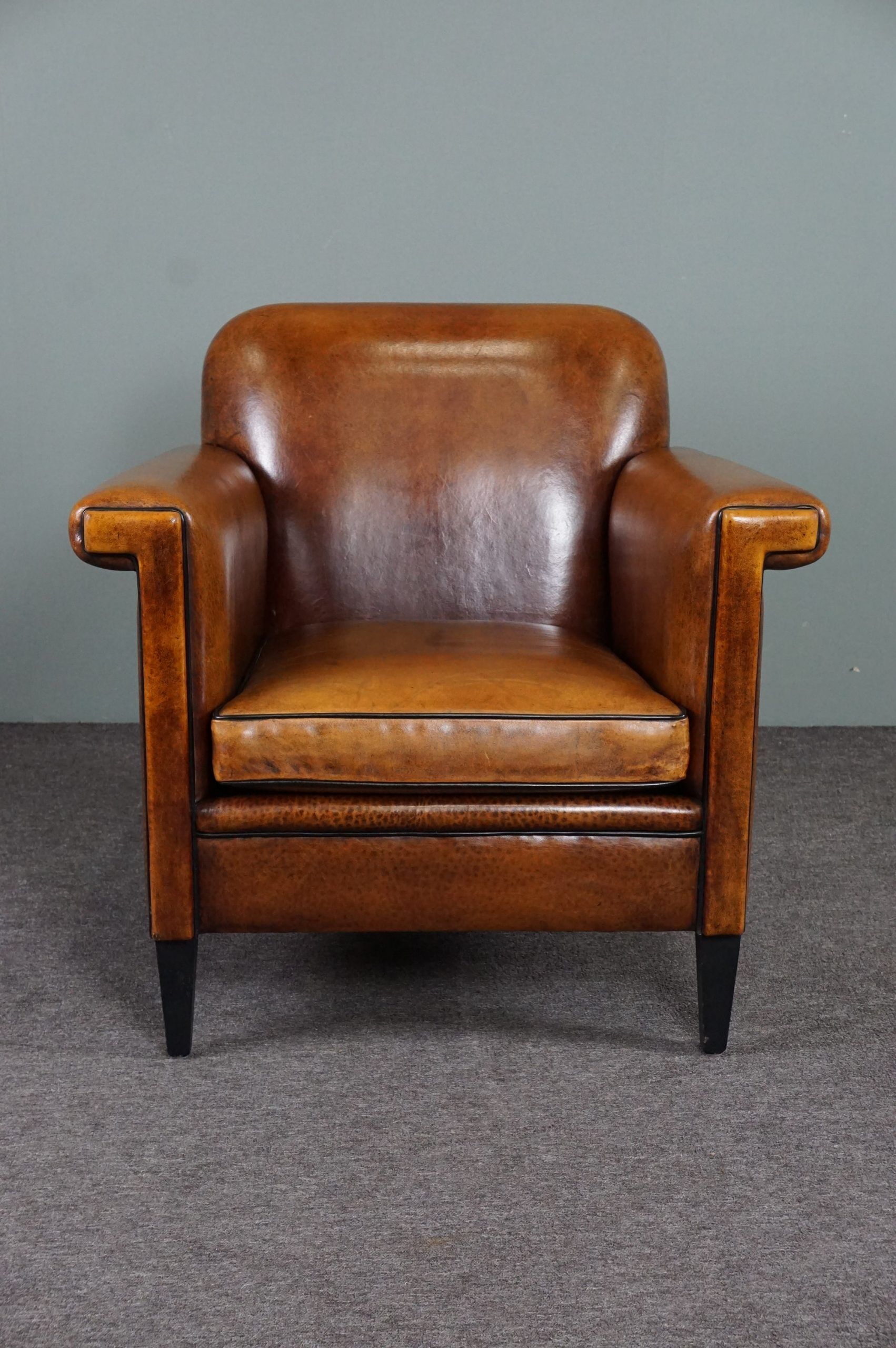 Schapenleren armchair and studio lounge stool