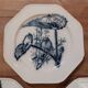 Set of three ironstone plates decorated with birds.