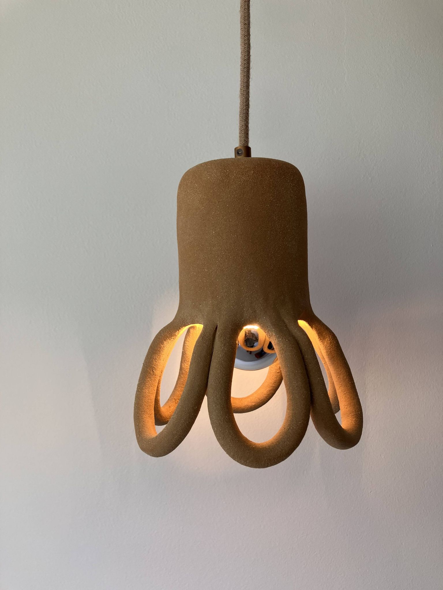 Suspension in the shape of a flower made of handcrafted ceramic, raw red stoneware mid-century.