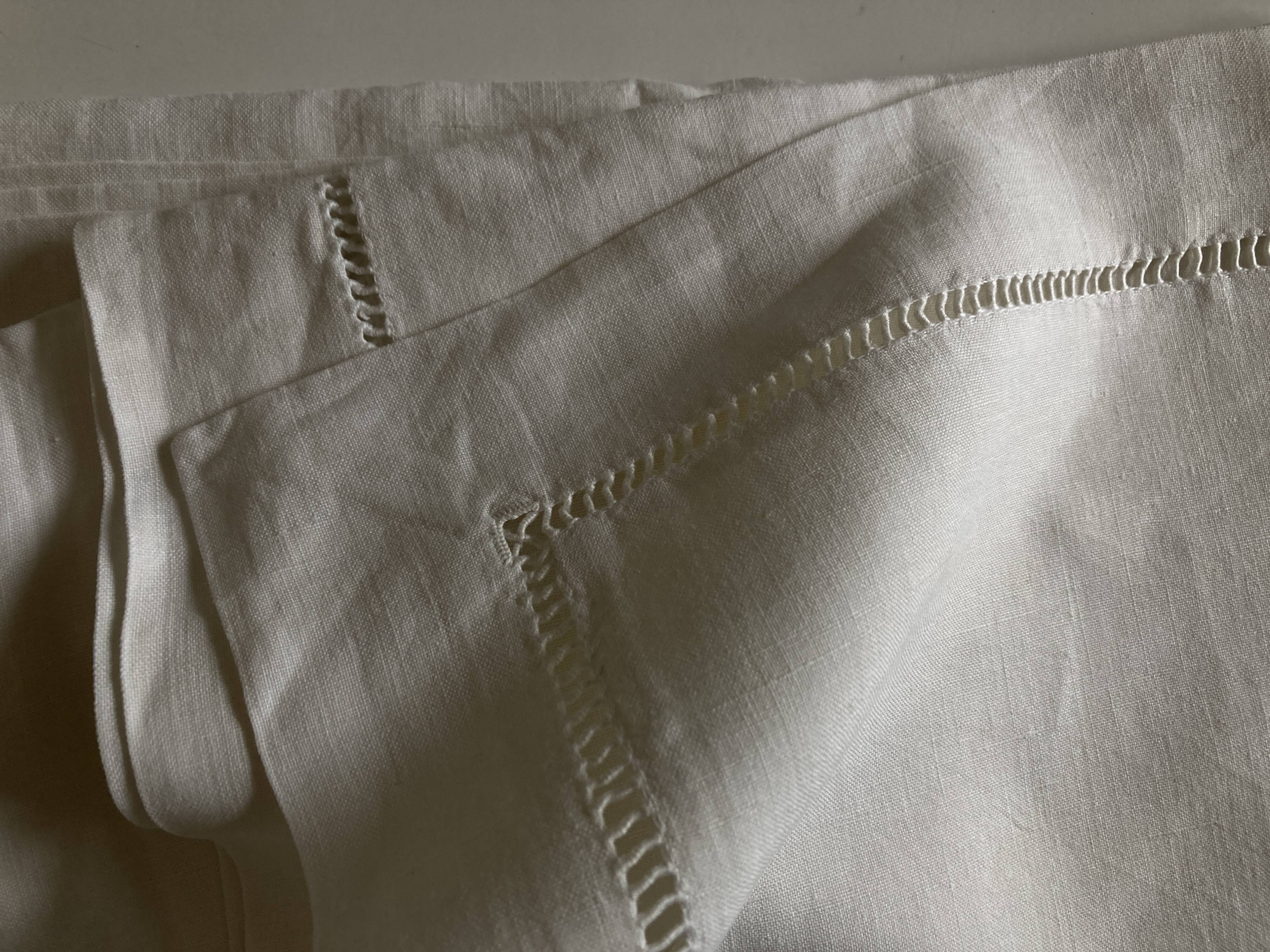 Pair of modernist linen pillowcases embroidered with comic strips