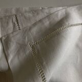 Pair of modernist linen pillowcases embroidered with comic strips