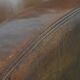 Characterful vintage sheepskin leather armchair with beautiful colours