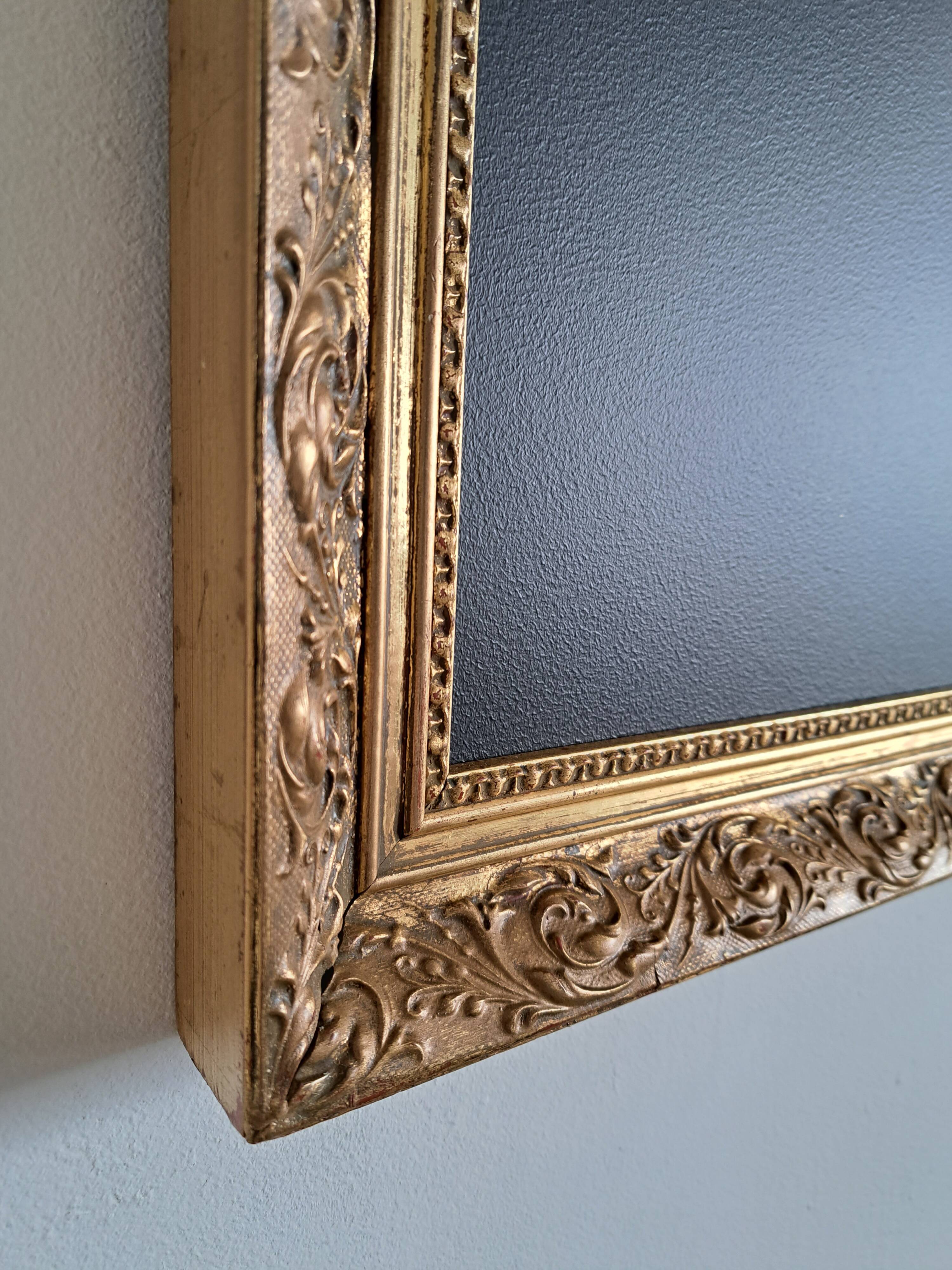Slate table framed in gold leaf style
