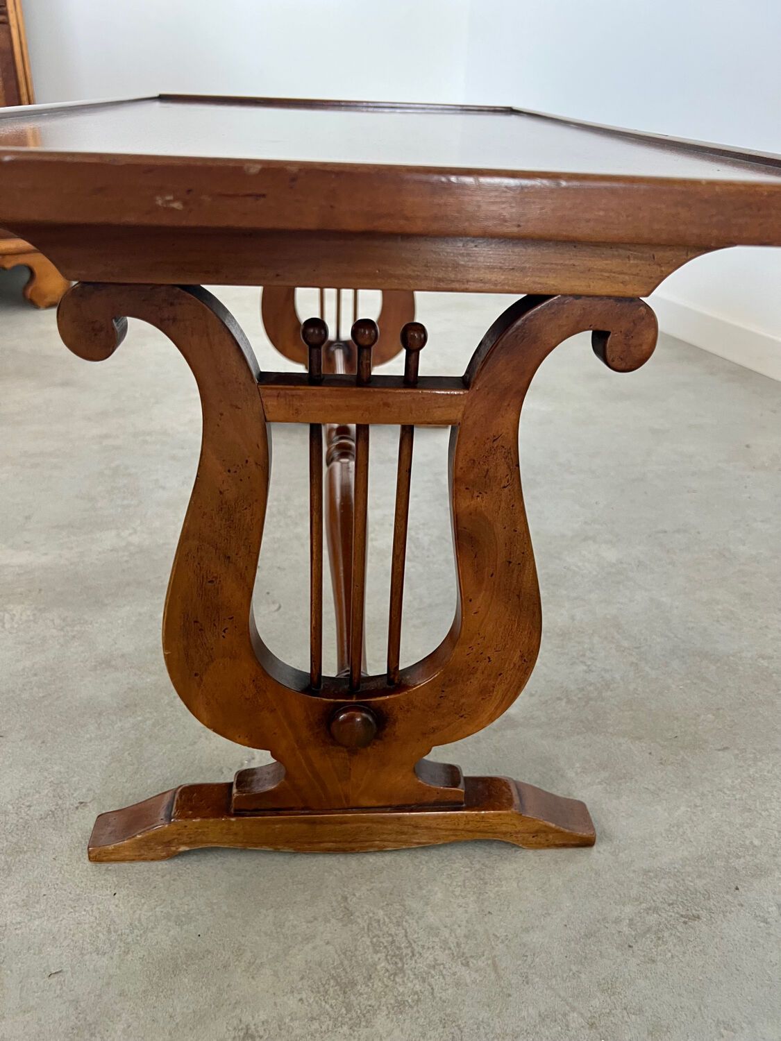 Old rectangular wood coffee table with lyre side posts