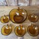 Salad bowl and apple raviers in amber glass 70 years