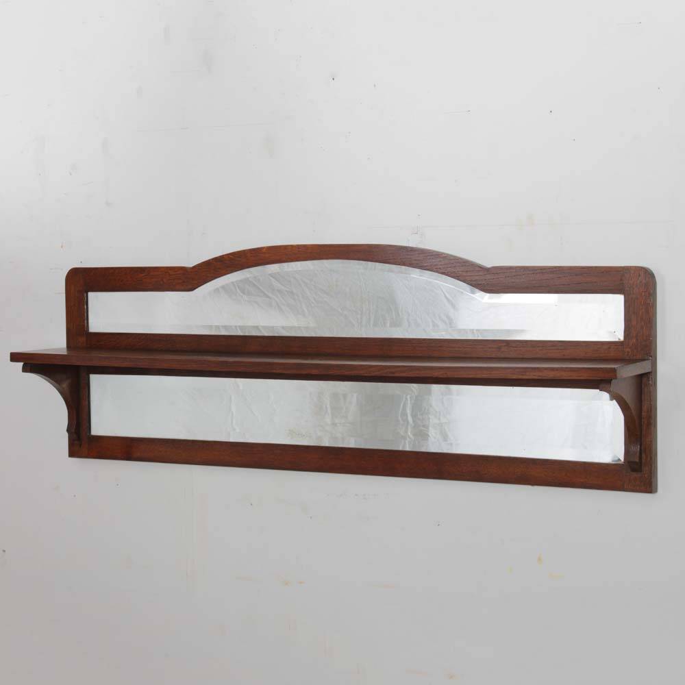 Shelf-shaped mirror, work from the early 20th century.