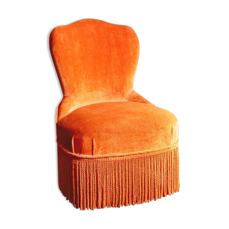 Velvet toad armchair and orange fringes