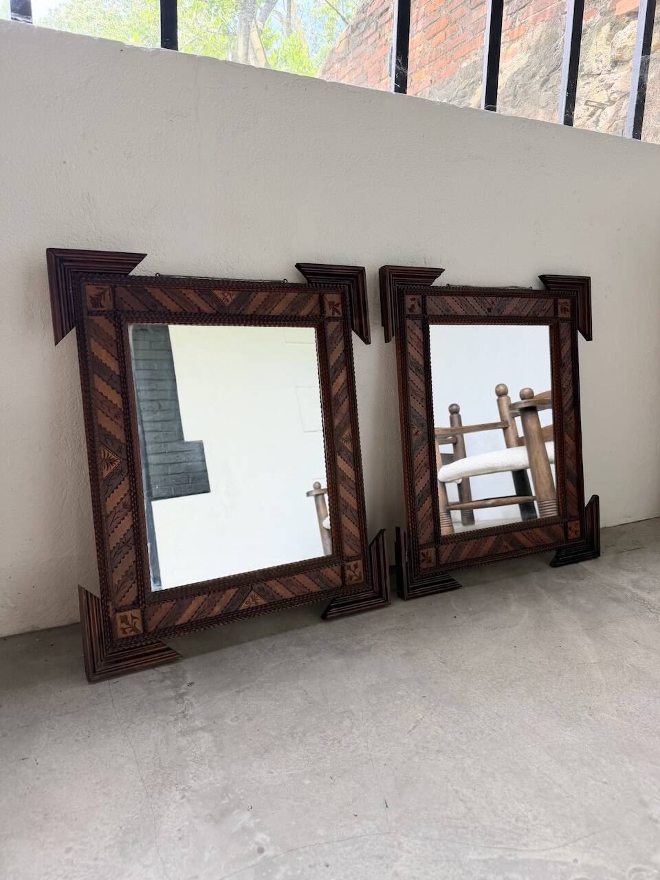 Pair of wooden mirrors in tramp art style