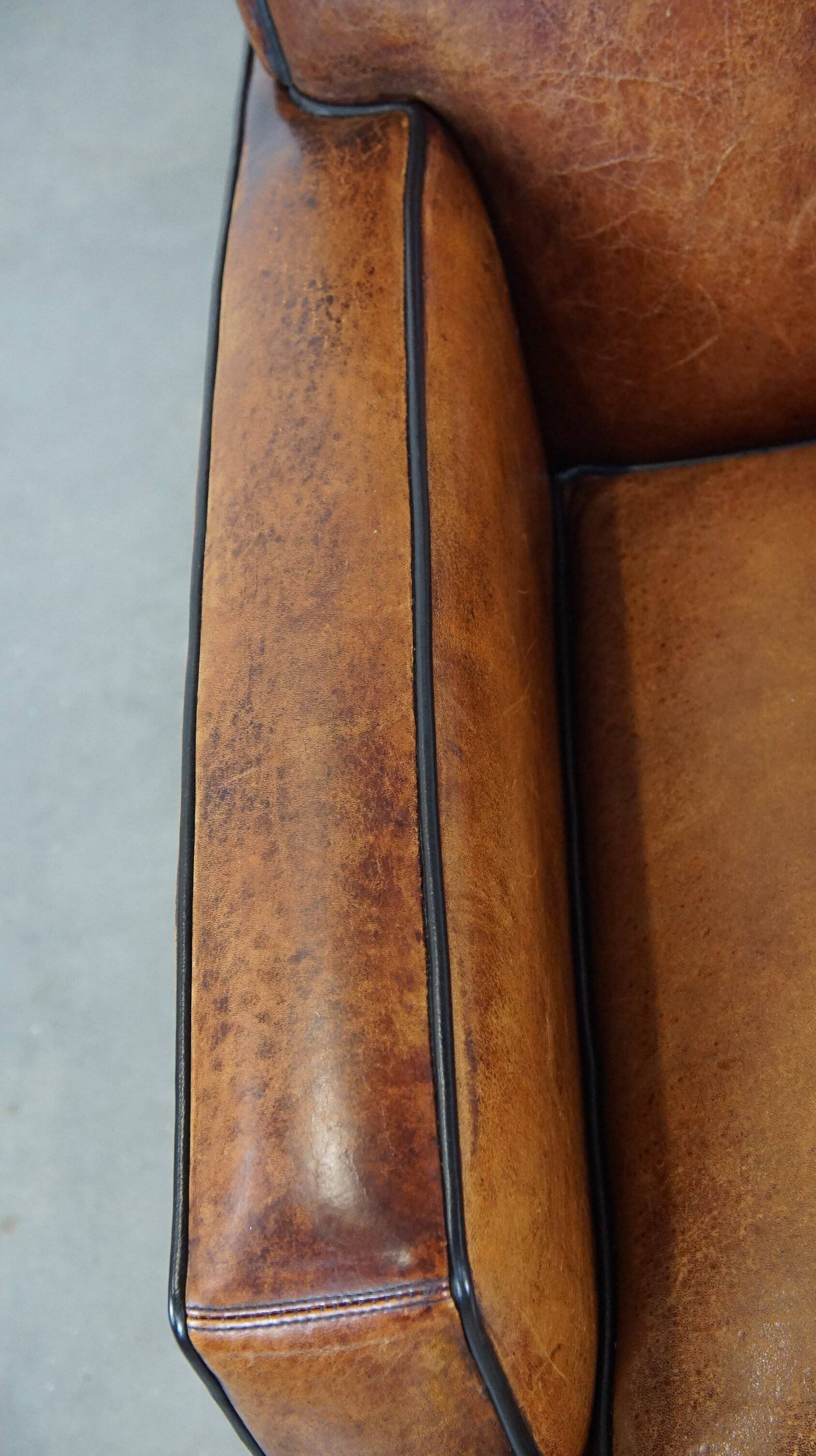 Art Deco sheep leather armchair with a lot of character