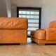 Paire de fauteuils vintage Gérard Guermonprez cuir fauve et inox, France 1970