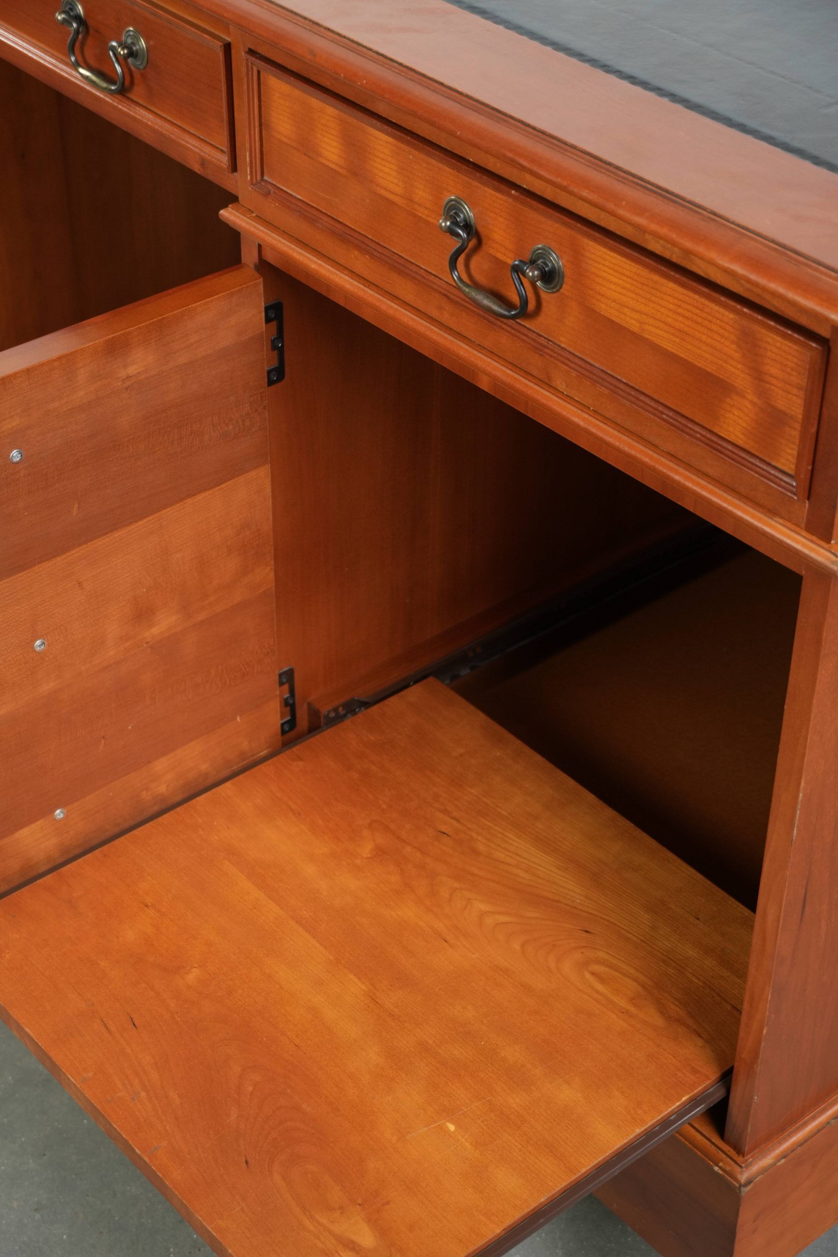 Classic wooden desk in English style with 4 drawers and a blue leather top