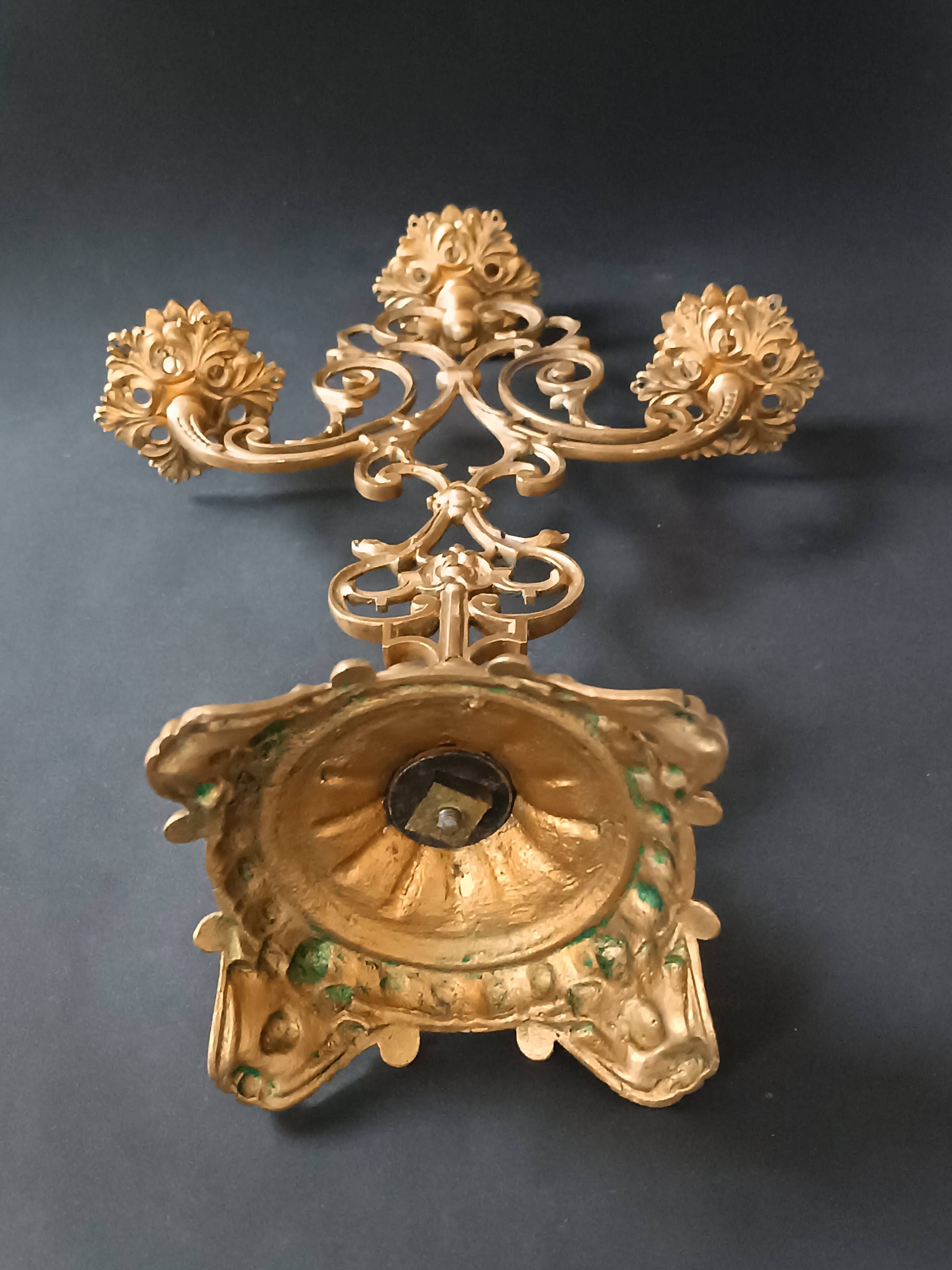 Antique three-light openwork brass church candelabrum.