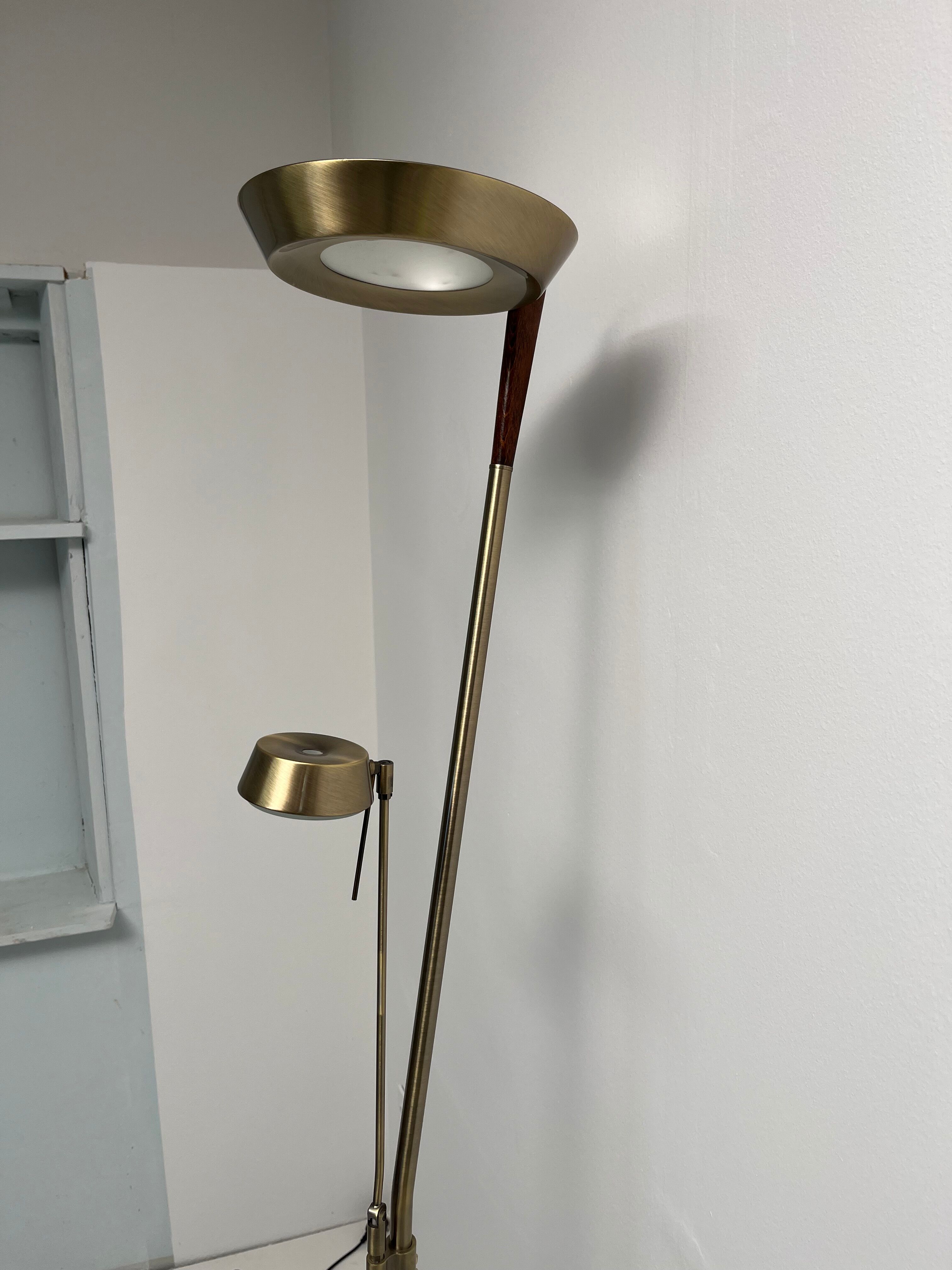 Golden metal floor lamp with reading light