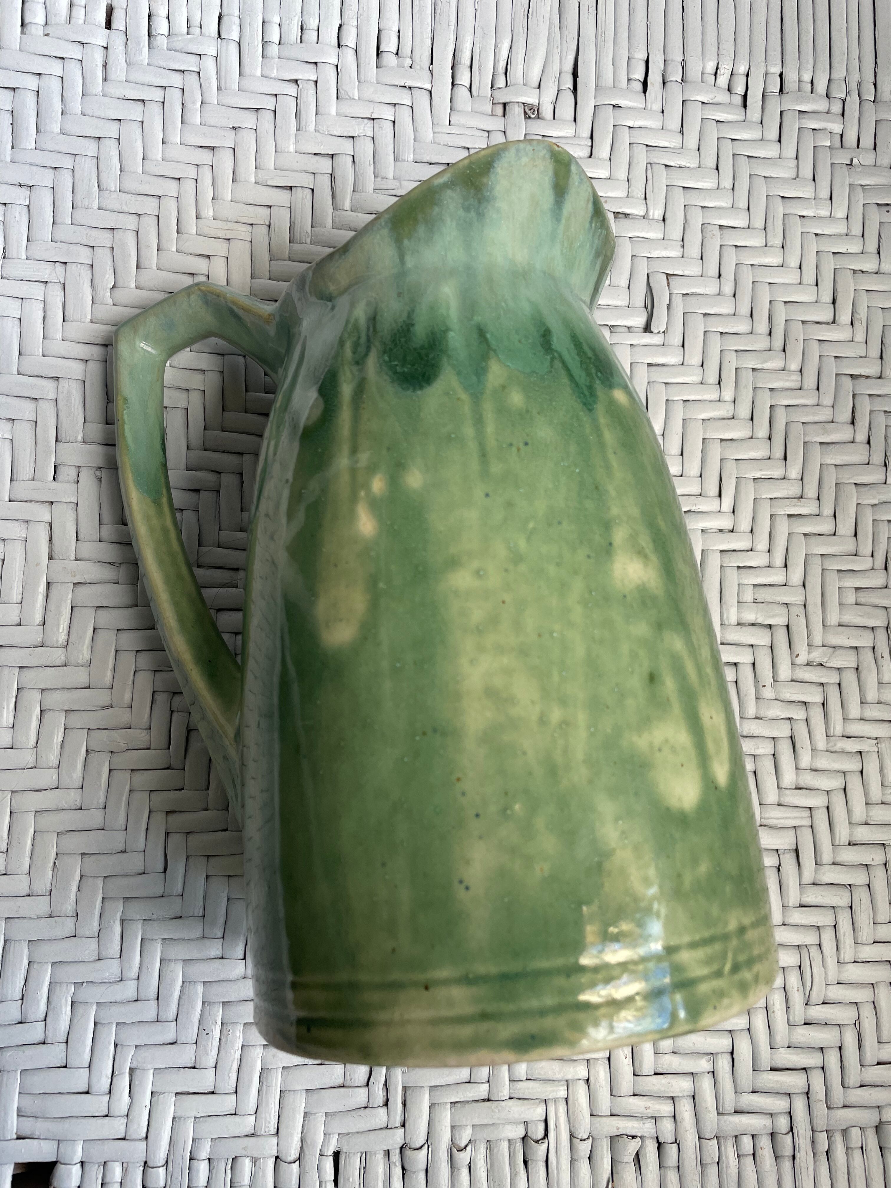 Turquoise green enamelled ceramic pitcher