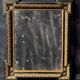 Napoleon III mirror in blackened wood and gilded decoration, second half of the 19th century.
