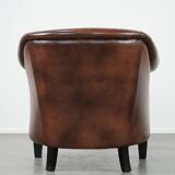 Great luxurious brown cowhide club armchair with matching piping