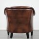 Great luxurious brown cowhide club armchair with matching piping