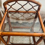 Two rattan and glass bedside tables