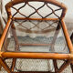 Two rattan and glass bedside tables
