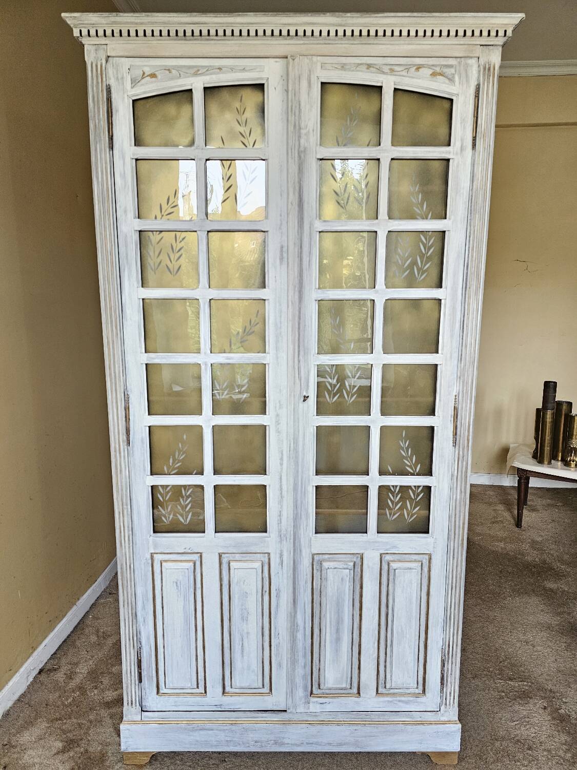 Antique bookcase with a white cerused patina