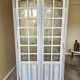 Antique library finished in white with a cerused effect.