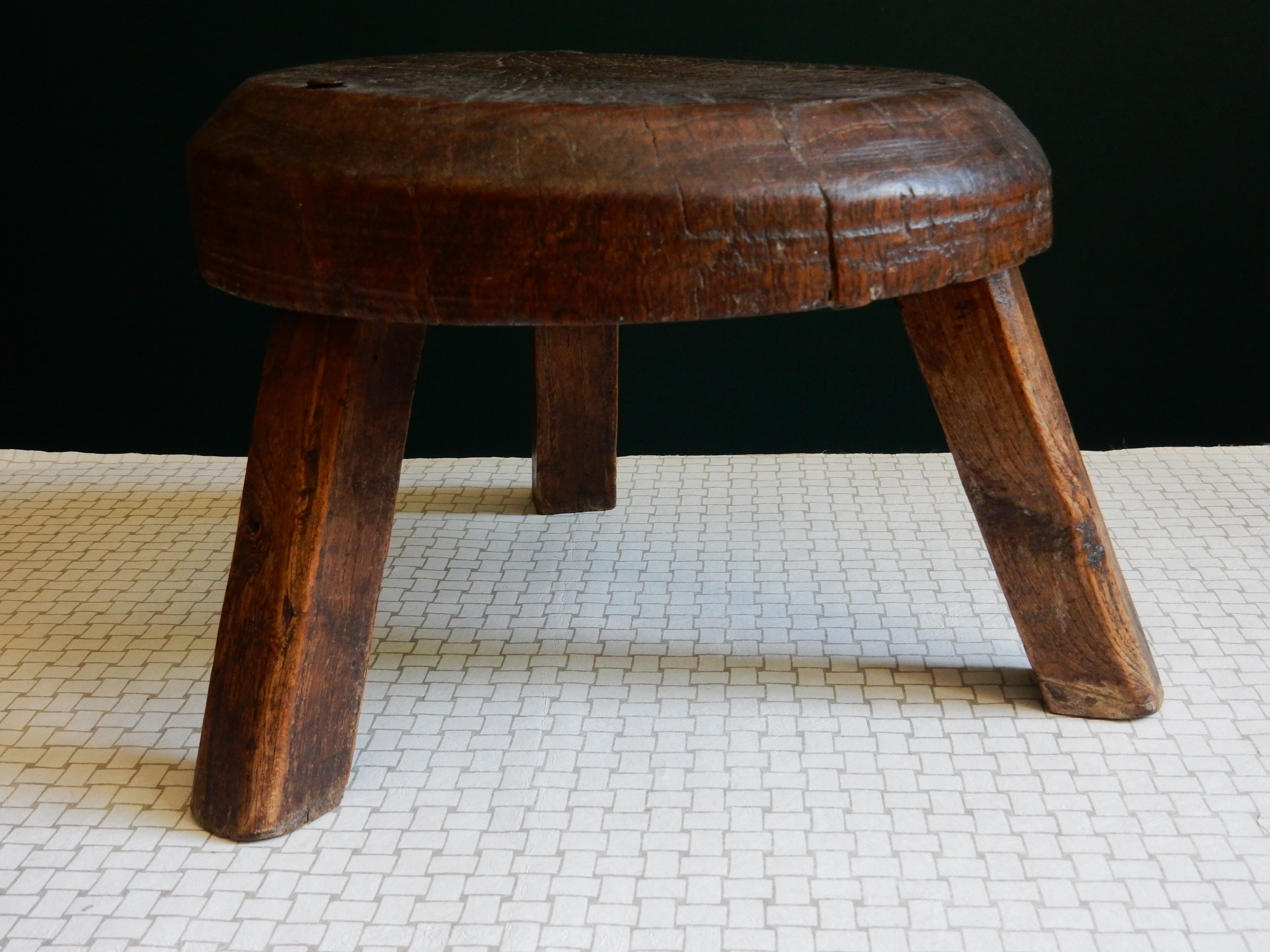 Small wooden farm tripod stool