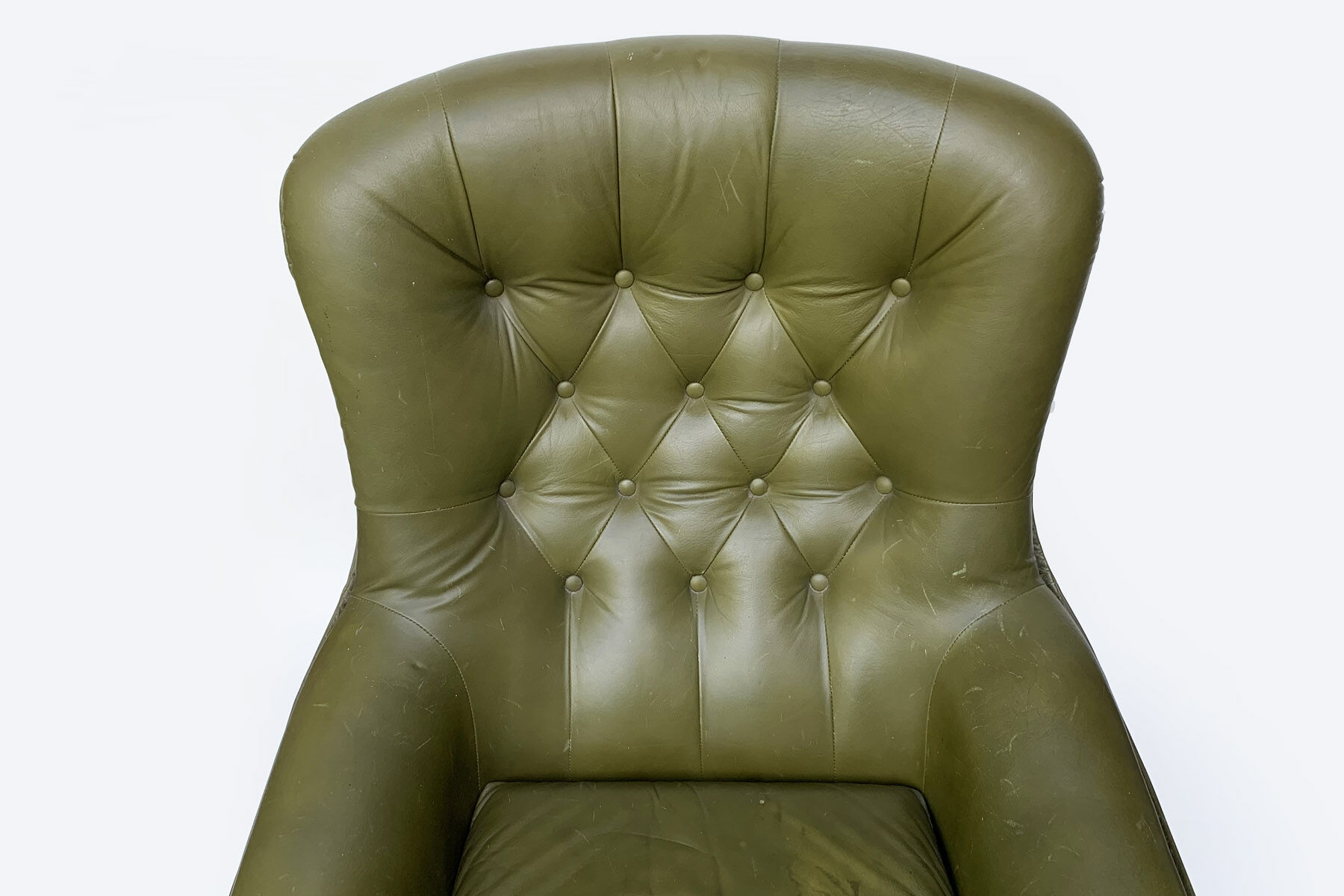 Swivel armchair in olive green leather 1970s