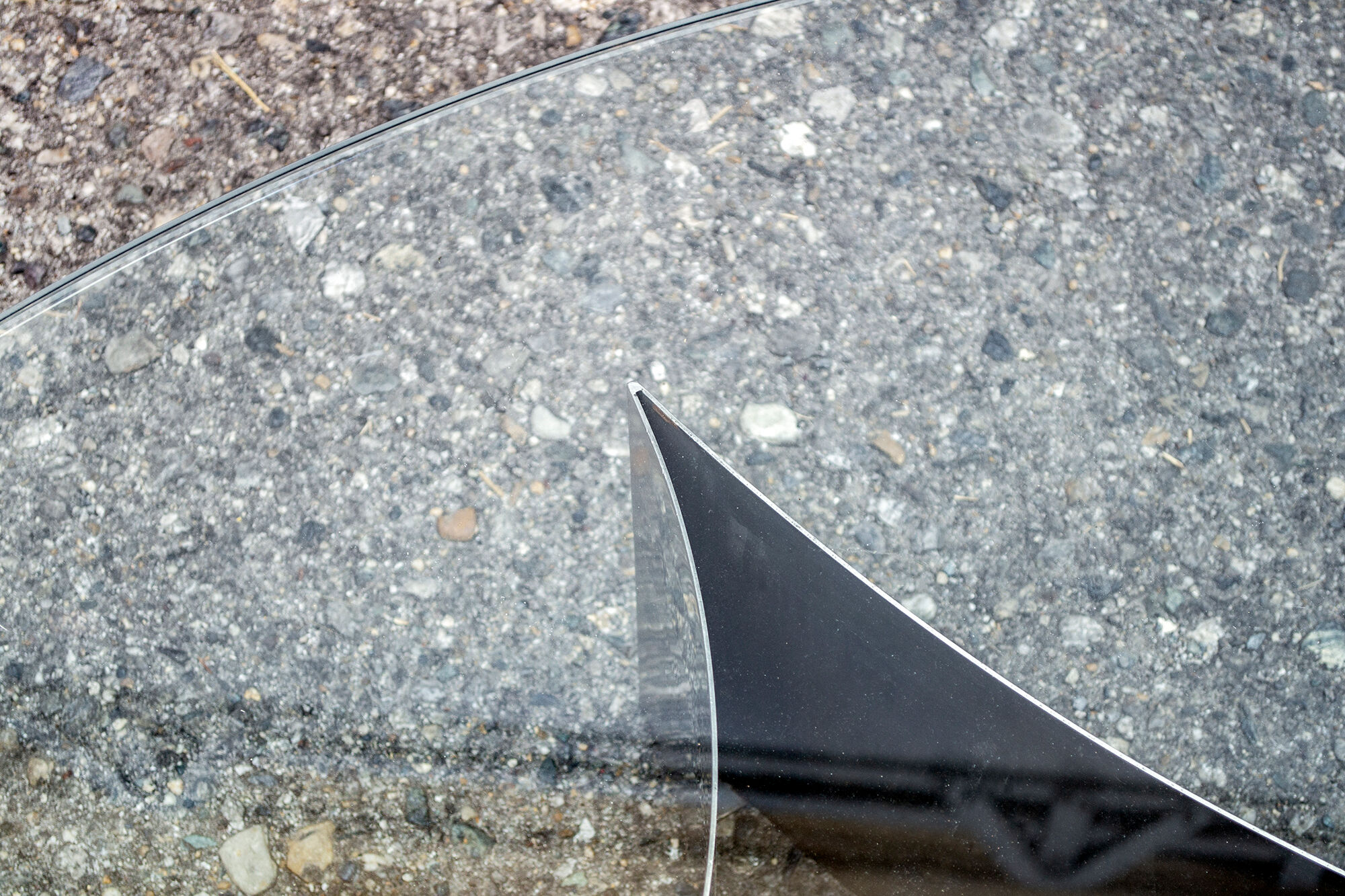Brutalist coffee table with steel base and 70s glass top