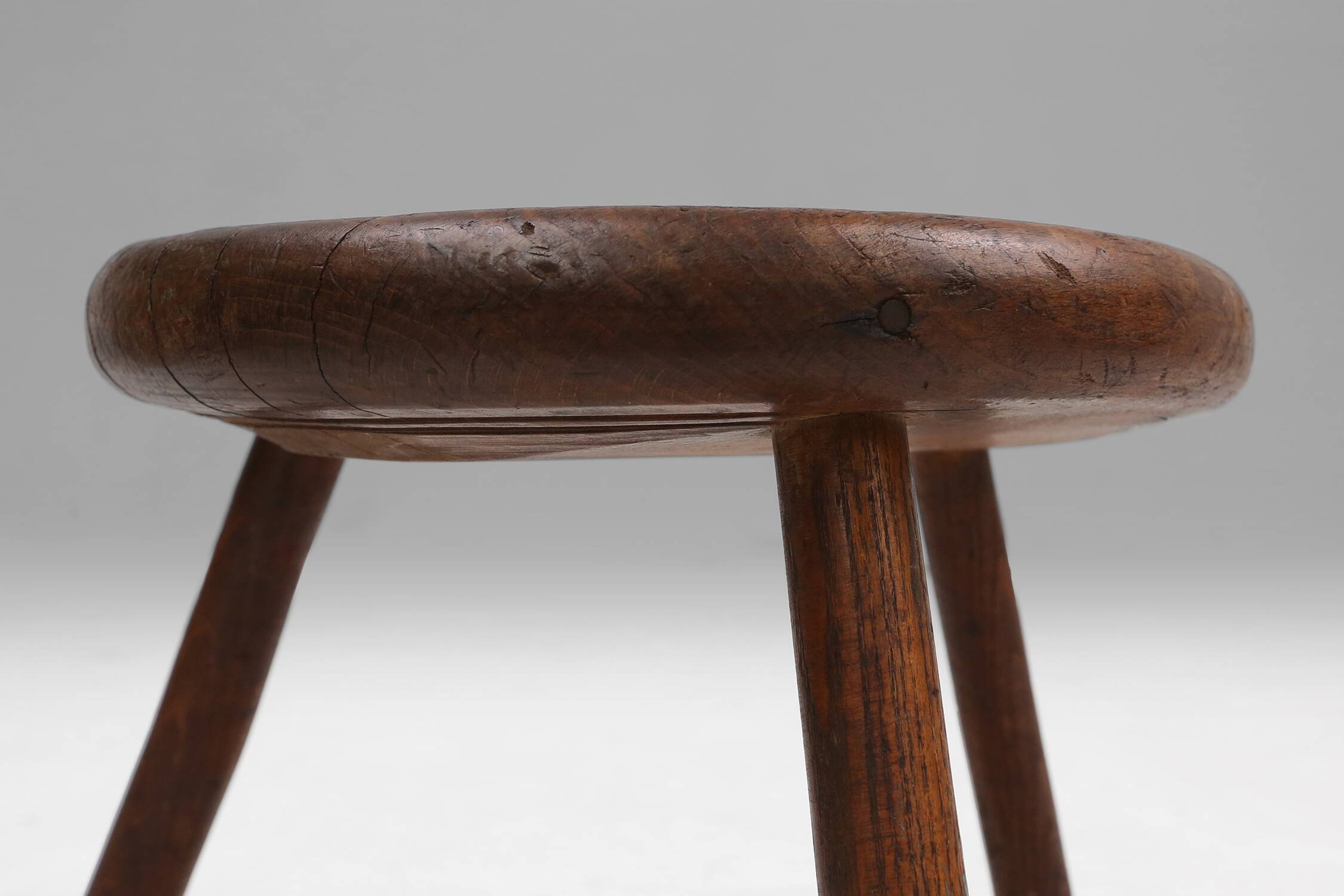 Hand-carved solid wood tripod stool with beautiful patina, France ca. 1900
