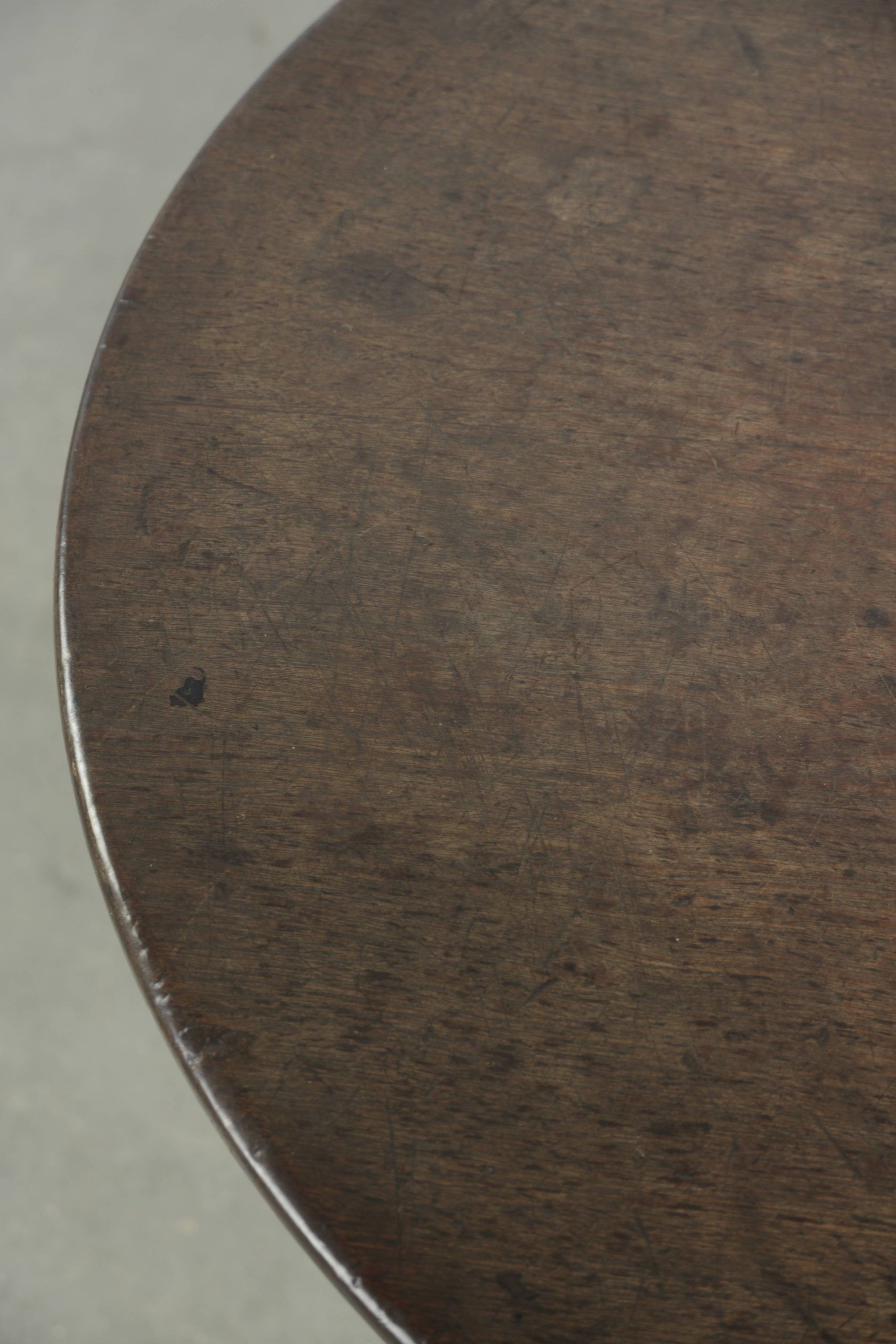 Practical round antique English tilt top table from the 18th century