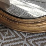 Antique oval gilded stucco mirror