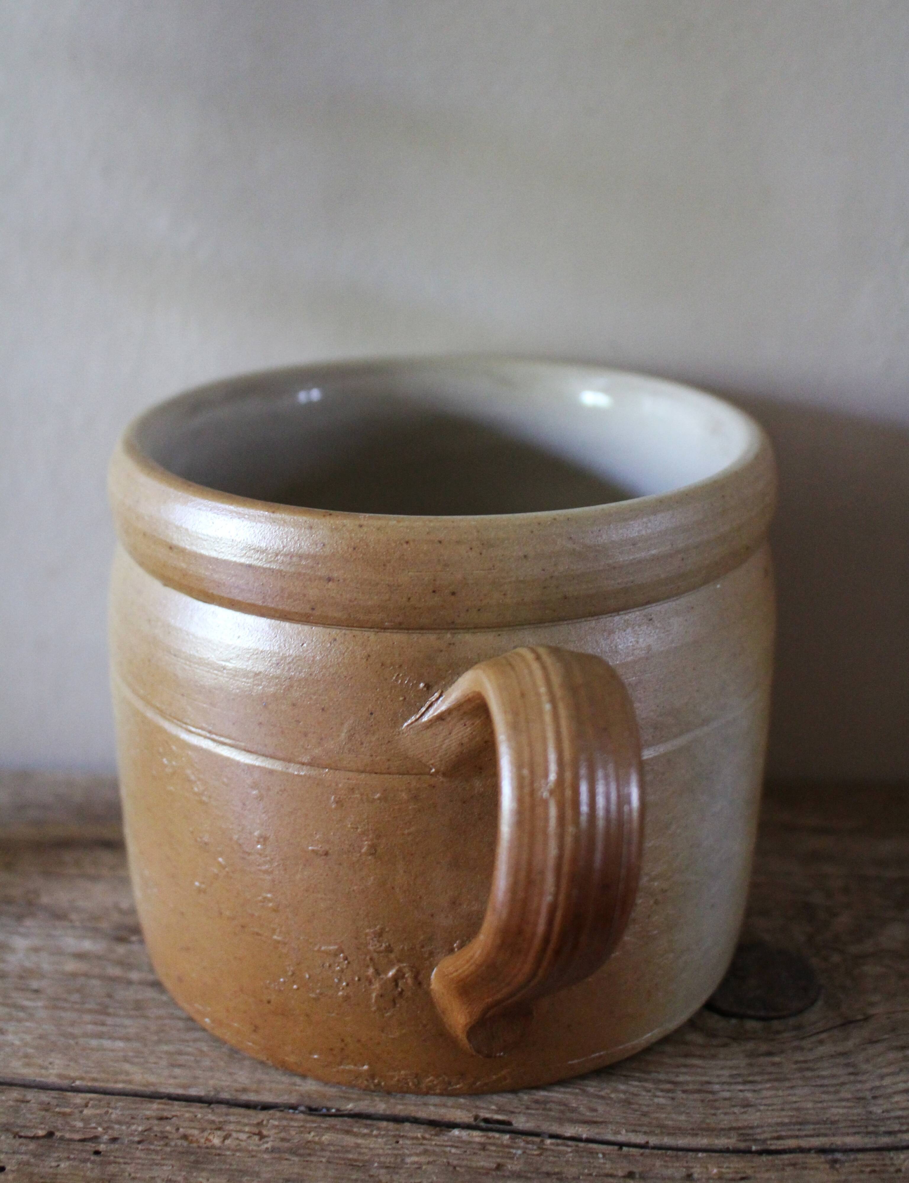 Vase terracotta milk jug with a glazed interior handle.