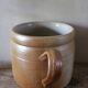 Vase terracotta milk jug with a glazed interior handle.