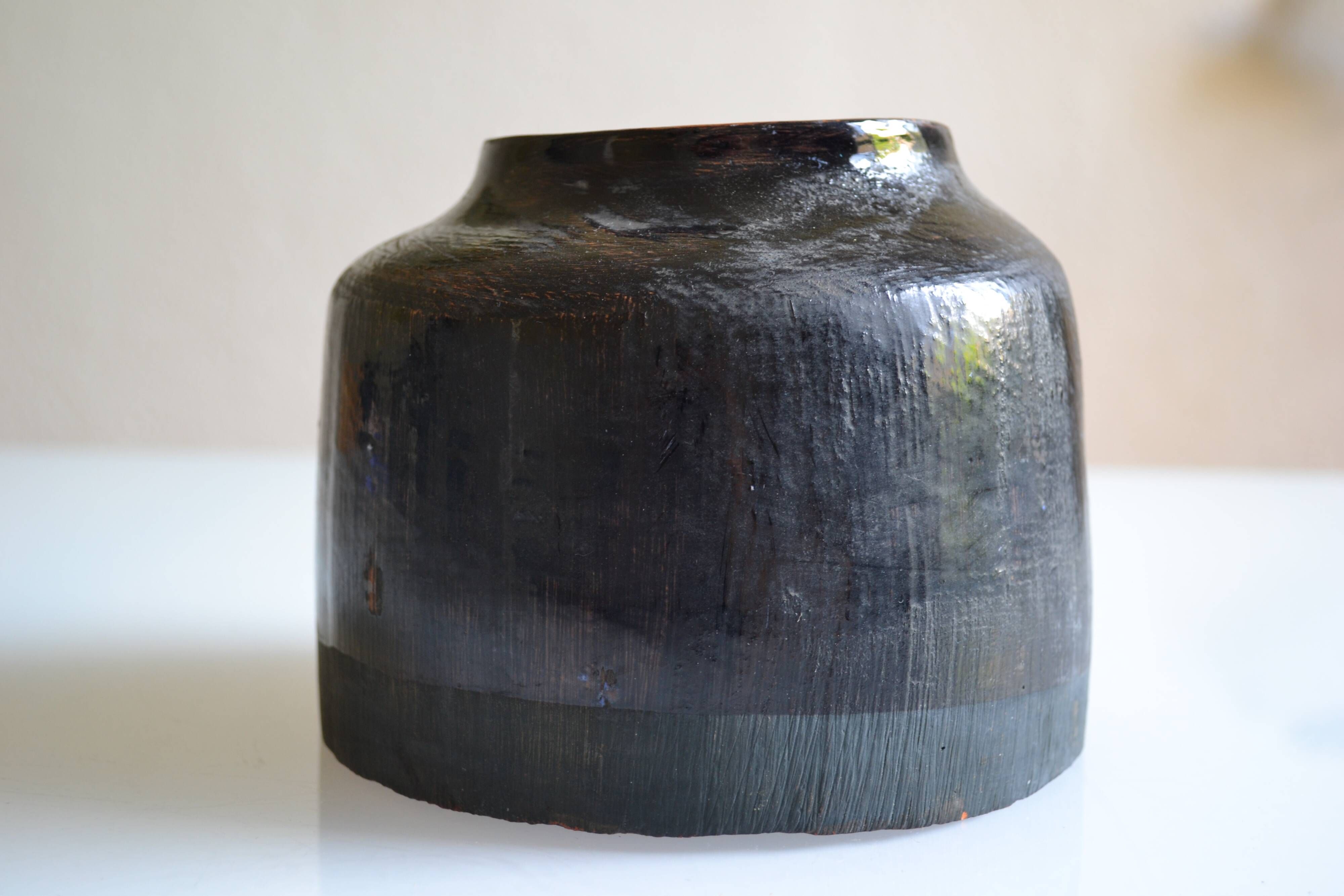 Ceramic vase with a signature fish to identify.
