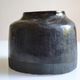 Ceramic vase with a signature fish to identify.