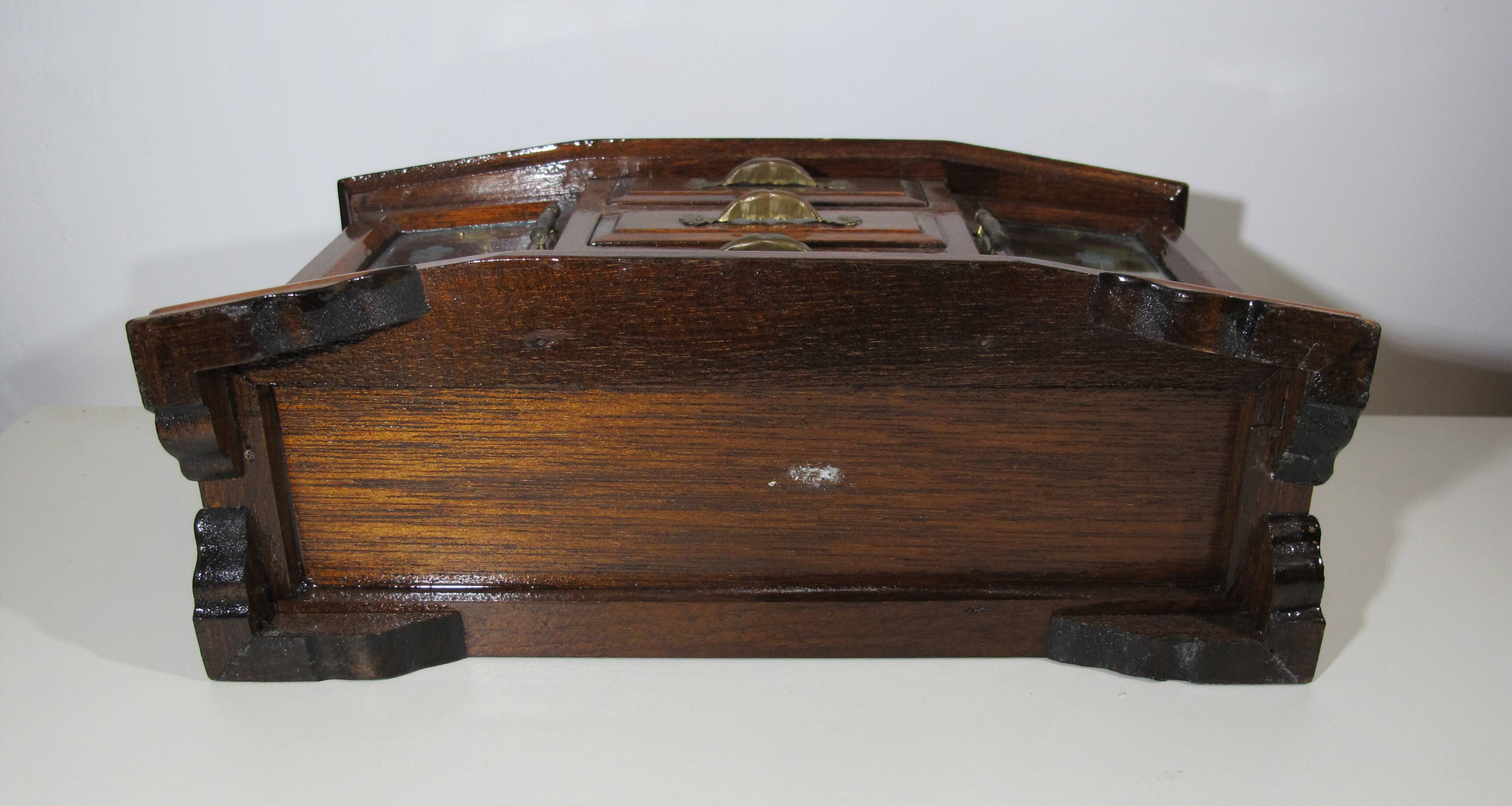 Wooden jewelry box in the shape of a dresser