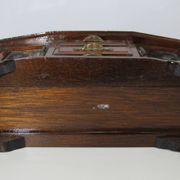 Wooden jewelry box in the shape of a dresser
