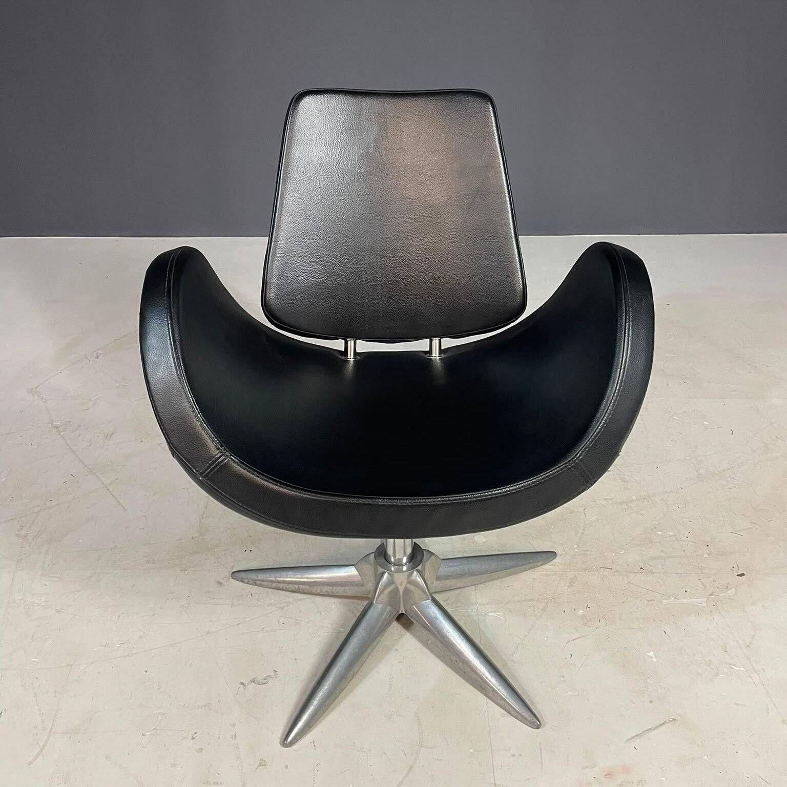 Alipes black swivel salon chair with chrome star base by Giorgetto Giugiaro