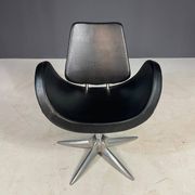 Alipes black swivel salon chair with chrome star base by Giorgetto Giugiaro