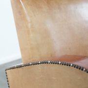 Art Deco design armchair in light cognac cowhide leather.