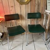 Pair of green faux leather chairs
