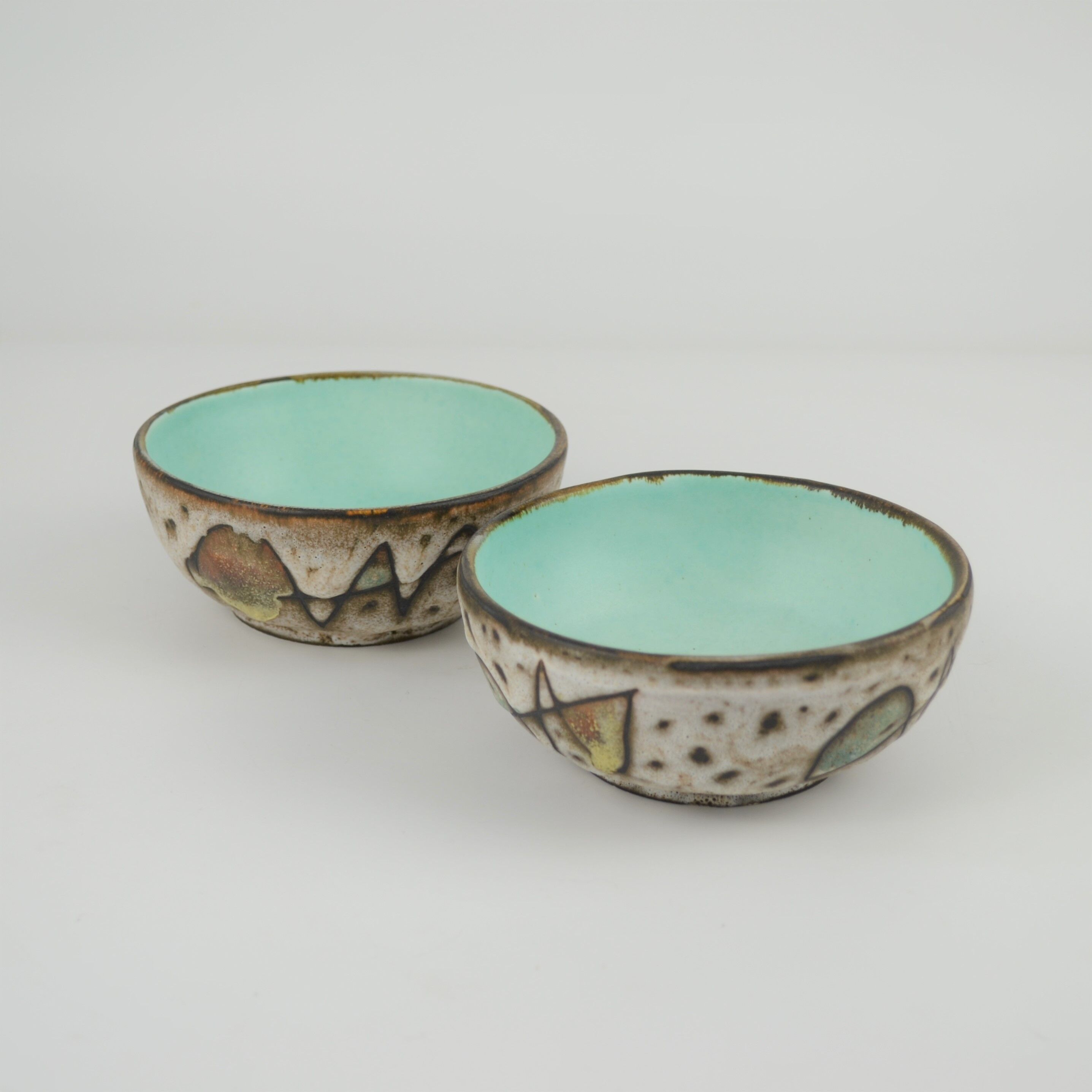 Pair of earthenware cups by Marius Bessone
