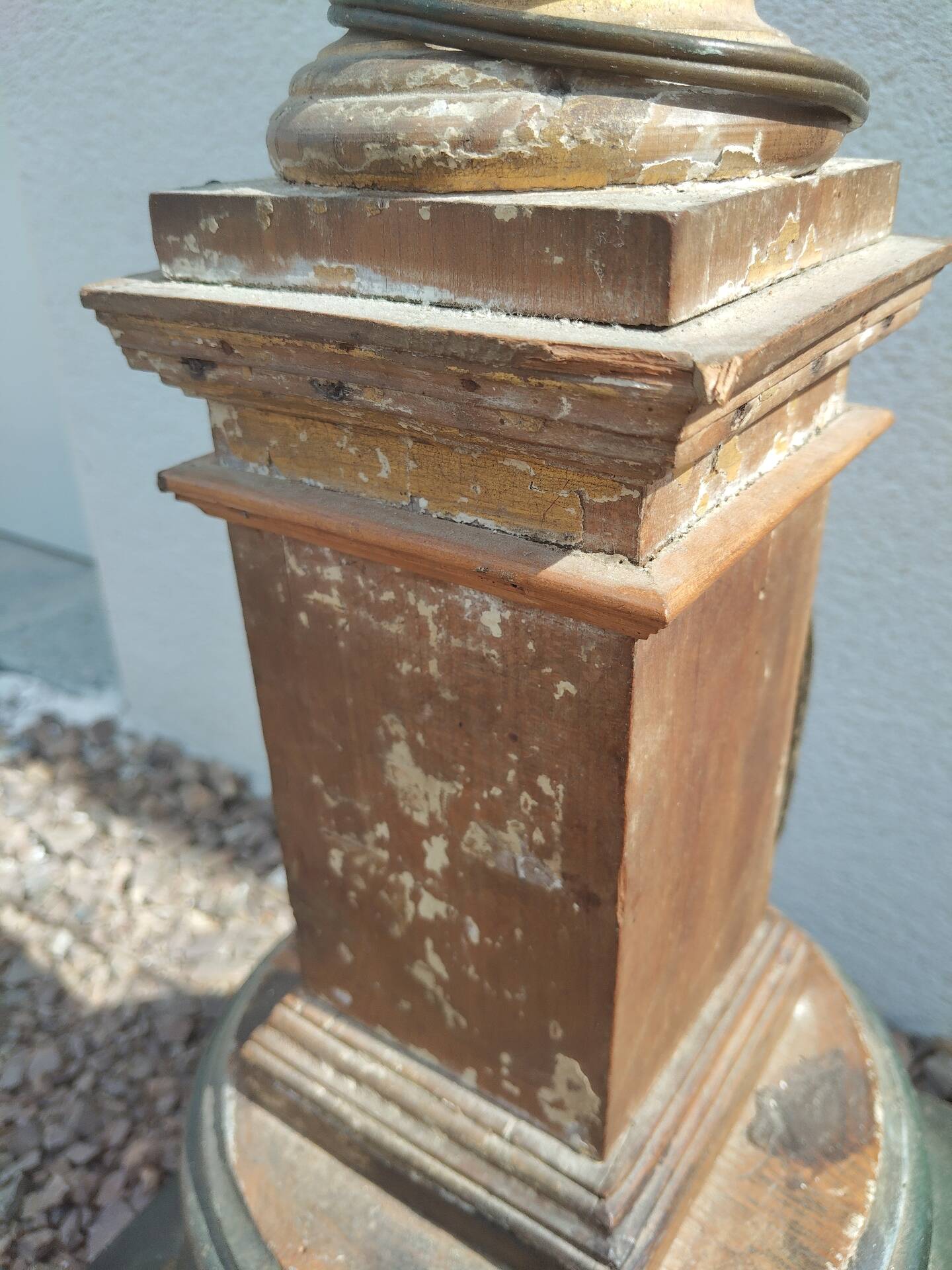 Large antique church candlestick in carved wood transformed into a lamp.