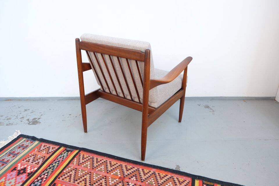 Vintage teak lounge chair, retro 1960s–70s style.