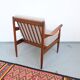 Vintage teak lounge chair, retro 1960s–70s style.