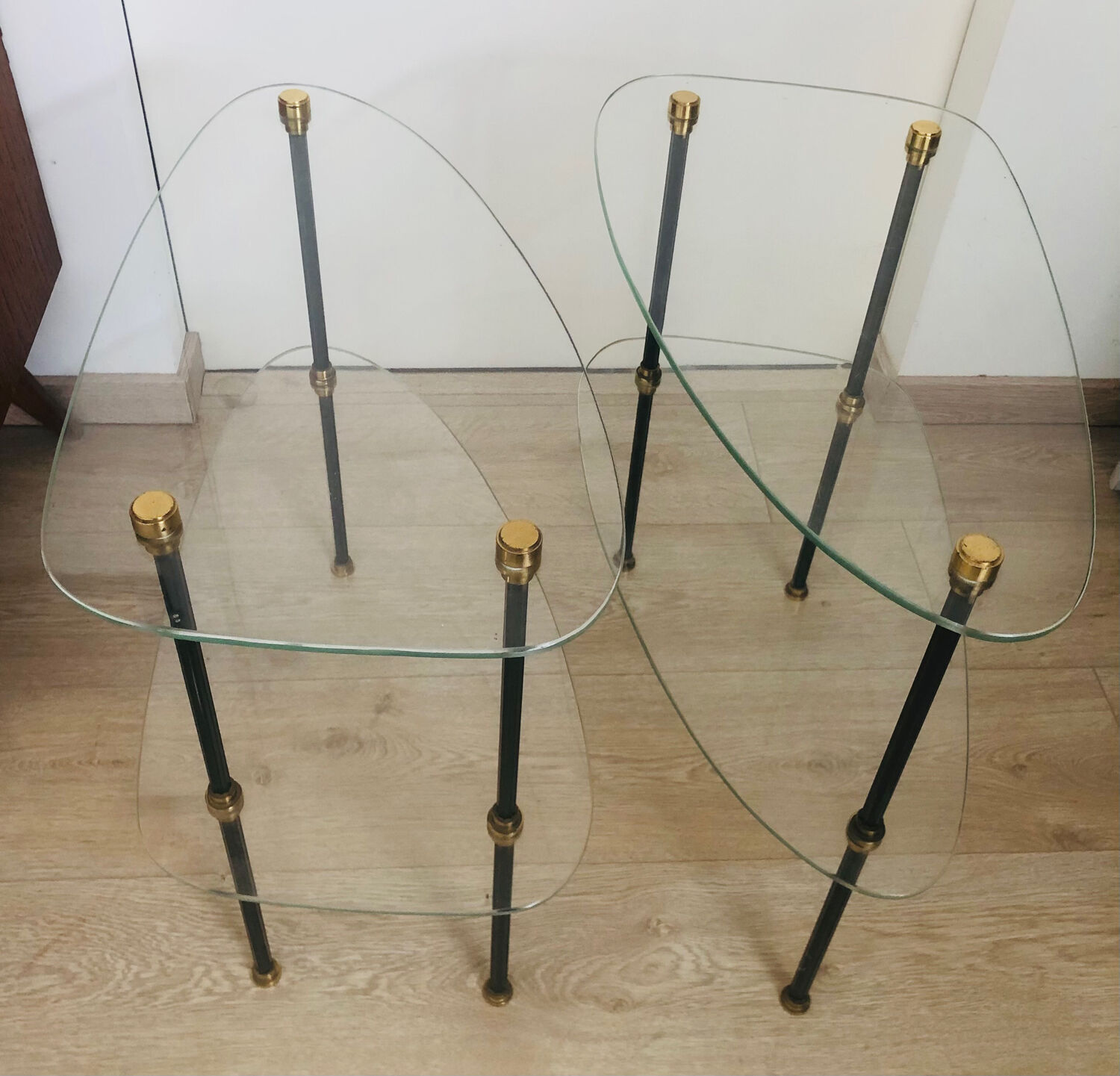 2 small side tables in glass and Bakelite with gold nuts from the 1960s.