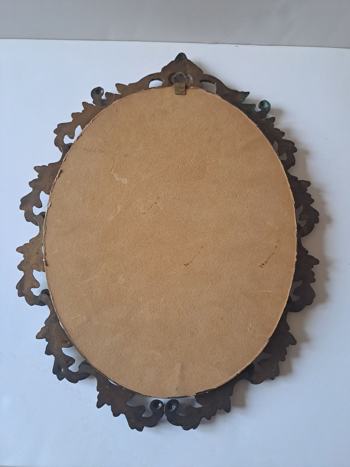 Painted under glass convex medallion in bronze