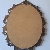 Painted under glass convex medallion in bronze