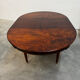 Extendable mahogany round table in Louis XVI style